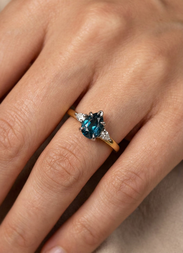 1.02ct Pear Shaped Teal Sapphire Trilogy Ring James Newman Jewellery