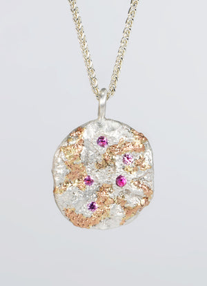 Pink Sapphire Encrusted Round Silver Flux Pendant with Red Gold Detail James Newman Jewellery