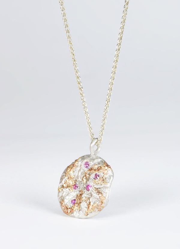 Pink Sapphire Encrusted Round Silver Flux Pendant with Red Gold Detail James Newman Jewellery