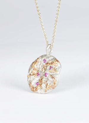 Pink Sapphire Encrusted Round Silver Flux Pendant with Red Gold Detail James Newman Jewellery