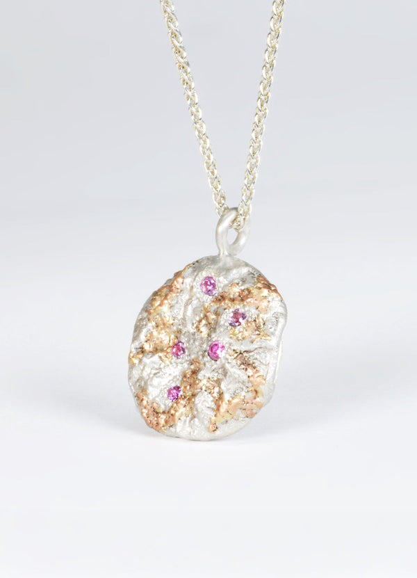 Pink Sapphire Encrusted Round Silver Flux Pendant with Red Gold Detail James Newman Jewellery