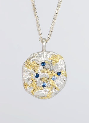 Sapphire Encrusted Round Silver Flux Pendant with Yellow Gold Detail James Newman Jewellery