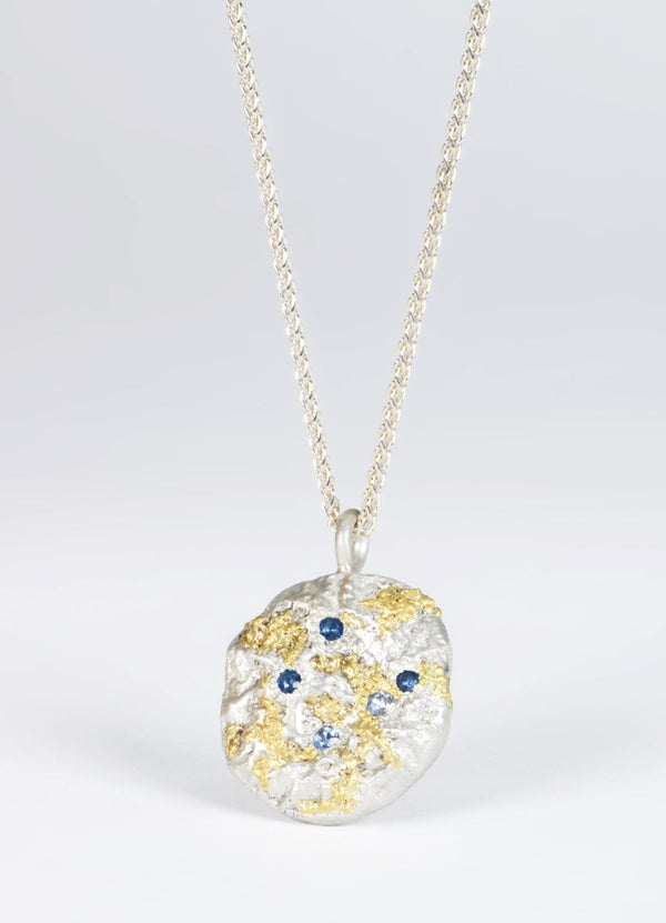 Sapphire Encrusted Round Silver Flux Pendant with Yellow Gold Detail James Newman Jewellery