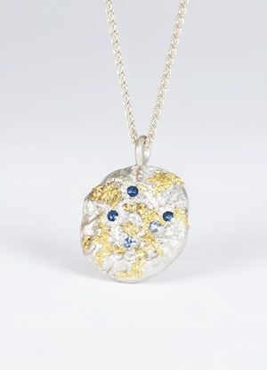 Sapphire Encrusted Round Silver Flux Pendant with Yellow Gold Detail James Newman Jewellery